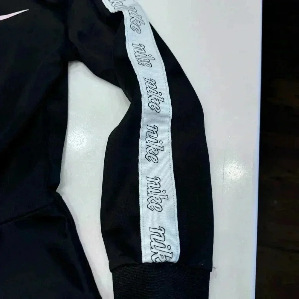 Nike Zip Up Jacket Girls Black and pink Swoosh Ruffle Hem Size 6 (5-6 Yrs)